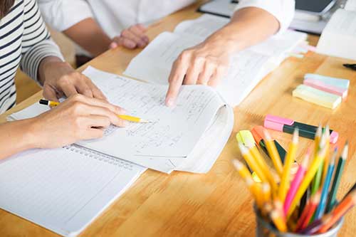 woman-tutoring-student